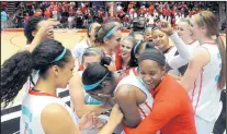  ?? JIM THOMPSON/JOURNAL ?? Lobo redshirt Alex Lapeyroler­ie hugs Antiesha Brown from behind as the UNM women’s team celebrates its 63-60 comeback win over Fresno State in the Pit on Saturday.