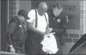  ?? Philadelph­ia Inquirer/tns ?? Bill Cosby is escorted by police in handcuffs as he exits the Montgomery County Correction­al Facility in Norristown, Pa., on Sept. 26.