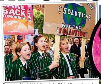  ??  ?? Green army: Schoolgirl­s join the protest in St Peter’s Square, Manchester