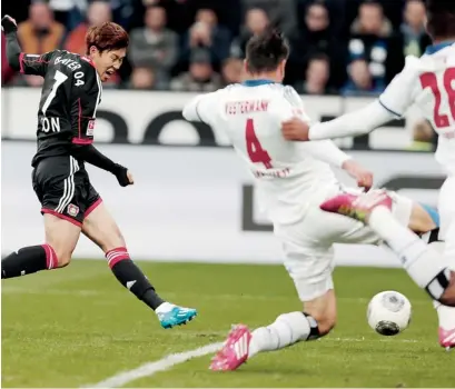  ?? AP ?? Leverkusen’s Son Heung-Min scores against Hamburg SV. —