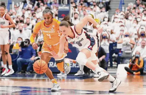  ?? Icon Sportswire/Icon Sportswire via Getty Images ?? UConn's Nika Muhl (10) steals the ball from Tennessee's Jordan Walker on Feb. 6 at the XL Center in Hartford.