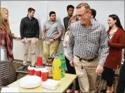  ?? HYOSUB SHIN / HYOSUB.SHIN@AJC.COM ?? Dean Matthews, senior director of learning and developmen­t, leads a “Friendsgiv­ing” event at InComm with interns from University System of Georgia. Research finds students need diverse learning experience­s.