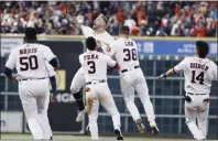  ?? ?? Houston pinch-hitter J.J. Matijevic, center top, celebrates with Jeremy Pena (3) and Korey Lee (38) after hitting a walk-off single in the ninth inning of the first game of Thursday's doublehead­er.