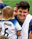  ?? GETTY IMAGES ?? Post-match hug: Maguire with his family