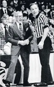  ?? Associated Press ?? JOHN WOODEN voiced his displeasur­e after senior forward Dave Meyers was called for a technical foul.