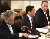  ?? (AP/Mark Schiefelbe­in) ?? Philippine President Ferdinand Marcos Jr. (second left) attends a trilateral meeting with President Joe Biden and Japanese Prime Minister Fumio Kishida (not pictured) Thursday in the East Room of the White House in Washington.