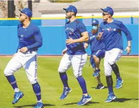 ?? TORONTO BLUE JAYS/USA TODAY SPORTS ?? Blue Jays newcomer George Springer, left, took a pass on Sunday's trip to Tampa, Fla., where the team will play its first exhibition game.