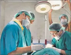  ?? GETTY IMAGES AND SAUMYA KHANDELWAL ?? (L) A research assistant prepares a syringe at a laboratory for a male contracept­ive at IIT Kharagpur. (Above) Doctors at a hospital in Delhi inject 29yearold Fauji with the contracept­ive as part of an ongoing clinical trial.