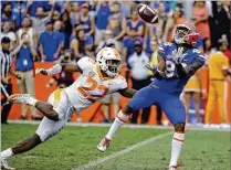  ?? JOHN RAOUX / ASSOCIATED PRESS ?? UF receiver Tyrie Cleveland catches the winning 63-yard touchdown pass from Feleipe Franks in front of Tennessee defensive back Micah Abernathy as time expired in 2017.