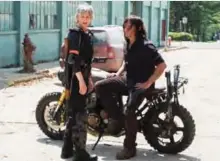  ?? — AP ?? This image released by AMC shows Melissa McBride as Carol Peletier, left, and Norman Reedus as Daryl Dixon in a scene from “The Walking Dead.”