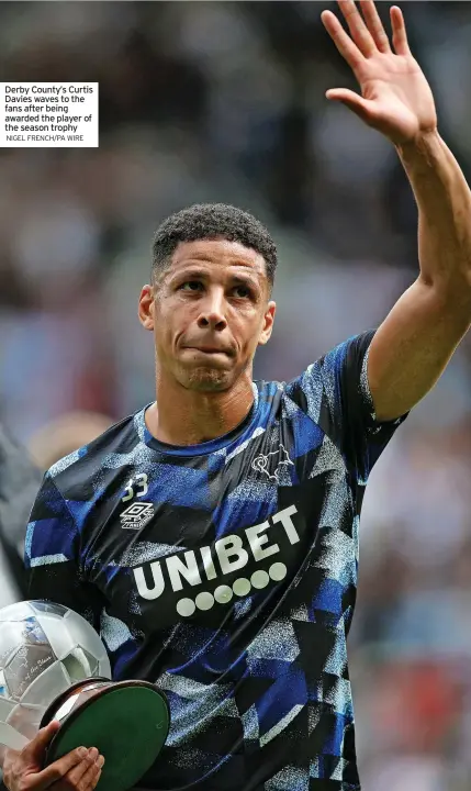  ?? NIGEL FRENCH/PA WIRE ?? Derby County’s Curtis Davies waves to the fans after being awarded the player of the season trophy