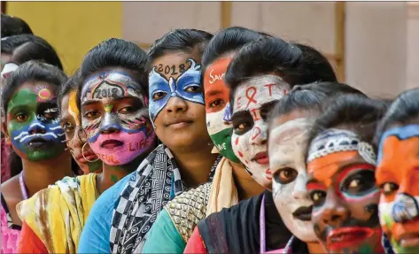  ?? IANS ?? College students showcase face painting on different themes ahead of New Year in Chennai on Wednesday.