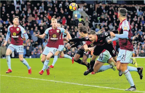  ?? Jan Kruger ?? James Tarkowski’s challenge on Aaron Ramsey which led to the decisive penalty at Turf Moor