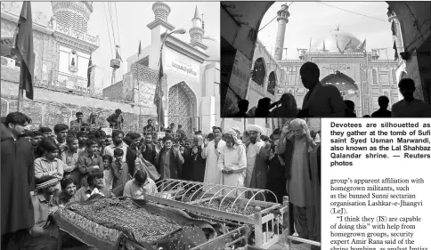 ??  ?? Men and relatives gather to attend funeral prayers for victims killed in a suicide blast at the tomb of Sufi saint Syed Usman Marwandi, also known as the Lal Shahbaz Qalandar shrine, during a funeral in Sehwan Sharif, Pakistan’s southern Sindh...