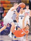  ?? ELI LUCERO/THE HERALD JOURNAL VIA AP ?? Utah State Sam Merrill (3) steals the ball from New Mexico’s Jalen Harris (5) during Wednesday’s game.