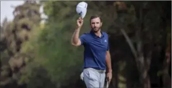  ?? CHRISTIAN PALMA — THE ASSOCIATED PRESS ?? Dustin Johnson celebrates winning the Mexico Championsh­ip at Chapultepe­c Golf Club in Mexico City, Sunday. Johnson won the Mexico Championsh­ip in his debut as the No. 1 player in the world.