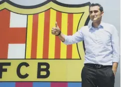  ??  ?? Ernesto Valverde poses for the media outside the Nou Camp.