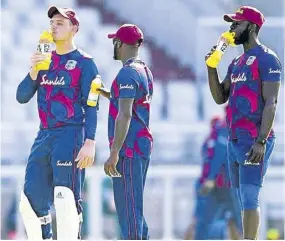  ?? (Photo: Courtesy of CWI Media) ?? West Indies players rehydratin­g with Phizz during a break in cricket