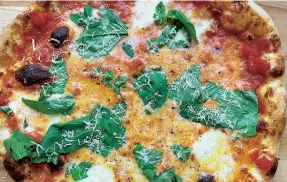  ??  ?? Sonny Stores’ pizza: ‘all puffy, blistered cornicione, thin crust, puddles of mozzarella and a tart tomato sauce’