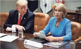  ?? EVAN VUCCI/AP ?? President Donald Trump’s secretary of education, Betsy DeVos, said Obama-era regulation­s gave the federal government an outsized role.