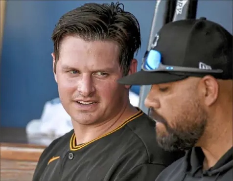  ?? Matt Freed/Post-Gazette ?? Kyle Crick, left, talks with new pitching coach Oscar Marin during an exhibition game in March. The Pirates need Crick to put 2019 — and Javier Vazquez — behind him.