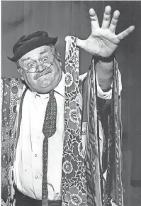  ?? COMMERCIAL APPEAL ?? Cliff Arquette (alias Charlie Weaver) shows off a double armload of neckties during a Memphis visit to the Mid-South Fair on 26 Sep 1961. BARNEY SELLERS / THE