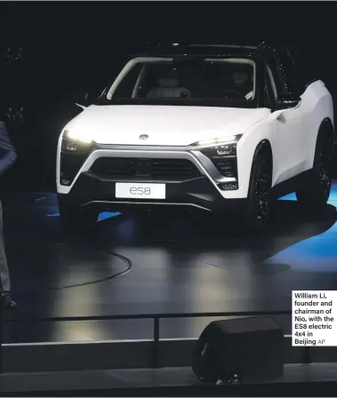  ??  ?? William Li, founder and chairman of Nio, with the ES8 electric 4x4 in Beijing AP