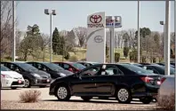  ??  ?? New Toyotas sitBloombe­rg News/DANIEL ACKERin a dealership lot last week in Moline, Ill. Toyota Motor Corp., the world’s largest carmaker, announced Wednesday that it was recalling more than 6 million vehicles to fix a range of safety defects in one of the biggest recalls in automotive history.