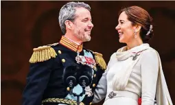  ?? (AFP) ?? HAIL TO THE KING — King Frederik X of Denmark and Queen Mary of Denmark on the balcony of Christians­borg Palace in Copenhagen, Denmark on Jan.14, 2024, after a declaratio­n on the accession to the throne by the Danish prime minister.