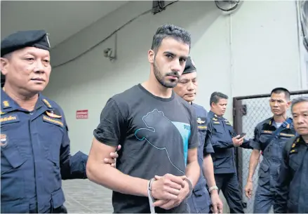  ?? AP ?? Thai prison guards lead Bahraini football player Hakeem al-Araibi, second left, from a courthouse in Bangkok on Dec 11.