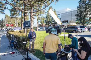  ?? — AFP photo ?? Media reporters gather by the main entrance of the Harbor UCLA Medical Center in Torrance, California where US Golf star Tiger Woods is hospitalis­ed.