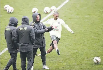  ??  ?? Brazilian national football team’s head coach Dunga (centre) supervises a training session of Brazil’s national football team at the Charlety Stadium in Paris ahead of a friendly match against France to be held at the Stade de France stadium in...