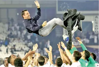  ?? AFP photo ?? Barcelona tried to recruit Xavi as their coach a week before his Qatar club Al-Saad were due to play a cup final, which they won. -