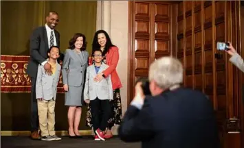  ?? Paul Buckowski / Times Union ?? Congressma­n Antonio Delgado, left, and his wife Lacey, far right, along with their twin boys, Maxwell and Coltrane, pose for a photo with Governor Kathy Hochul on Tuesday in Albany.