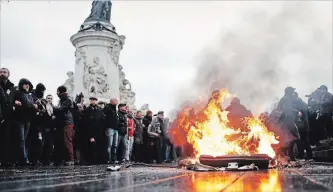  ?? THIBAULT CAMUS THE ASSOCIATED PRESS ?? A bin burns as school children demonstrat­e in Paris on Friday. Footage showing the brutal arrest of high school students protesting outside Paris is causing a stir ahead of further anti-government protests this weekend.