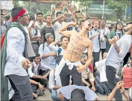  ?? A. M. AHAD — THE ASSOCIATED PRESS ?? Students shout slogans and block a road in Dhaka, Bangladesh, on Saturday. The demonstrat­ors were pressing their demand for safer roads.