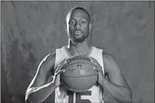  ?? CHUCK BURTON/AP PHOTO ?? Kemba Walker of the Hornets, the former UConn star, poses for a photo during the team’s media day on Monday at Charlotte, N.C.