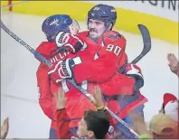  ?? AP PHOTO ?? Washington Capitals right wing Justin Williams (14) celebrates his winning goal with center Marcus Johansson (90), of Sweden, in the overtime period of Game 5 in an NHL Stanley Cup hockey first-round playoff series against the Toronto Maple Leafs,...