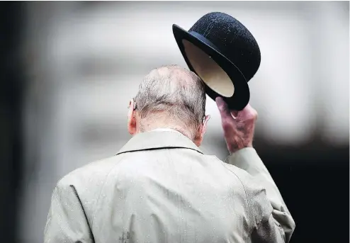  ?? HANNAH MCKAY / AFP / GETTY IMAGES ?? Prince Philip, Duke of Edinburgh, attends a parade to mark the finale of the 1664 Global Challenge at Buckingham Palace on Wednesday.