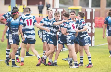  ?? Picture: Nev Madsen ?? FROM THE FRONT: St Mary's celebrate Blake Moore’s (number 6) try against Coombabah State High School.