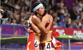  ?? Photograph: Xinhua/Shuttersto­ck ?? Lin Yuwei (left) hugs Wu Yanni after the Women's 100m hurdles final at the Asian Games in Hangzhou, eastern China.
