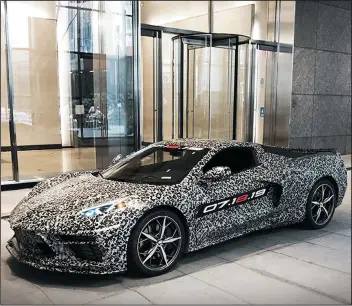  ?? GENERAL MOTORS ?? A camouflage­d pre-production model of the new Corvette, which will be unveiled next month.