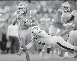  ?? Marcio Jose Sanchez Associated Press ?? JOSHUA KELLEY runs past Arizona State defensive lineman Roe Wilkins for one of his four scores as UCLA got its first home win of the season.