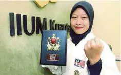  ??  ?? NUR Faiz Nabilah meraih pingat gangsa pada kejohanan Shito-Ryu Shukokai Karate-Do Dunia di Jepun.