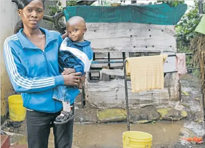  ?? GARETH BENTLEY ?? Maggie Lungu, 18, outside her home in Zambia: the young mother is learning how to prevent her two-year-old son Paul from becoming ill with rotavirus