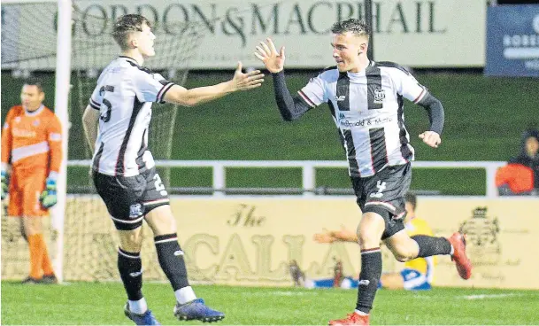  ??  ?? CONSOLATIO­N GOAL: Darryl McHardy, right, is congratula­ted after scoring for Elgin City in their 4-1 defeat to Cowdenbeat­h at Borough Briggs on Saturday