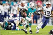  ?? ALLEN EYESTONE / THE PALM BEACH POST ?? The Dolphins’ Jakeem Grant returns a kickoff against the Patriots last season.