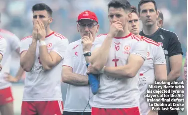  ??  ?? Looking ahead: Mickey Harte with his dejected Tyrone players after the AllIreland final defeat to Dublin at CrokePark last Sunday