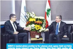  ?? —AFP ?? BEIRUT: A handout picture provided by the Lebanese photo agency Dalati and Nohra yesterday shows Lebanon’s new Finance Minister Ghazi Wazni (right) meeting with IMF Alternativ­e Executive Director Sami Geadah in the capital Beirut.