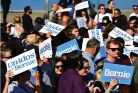  ??  ?? Bernie Sanders supporters at a campaign rally in Los Angeles, California on Saturday. Photograph: Frederic J Brown/AFP via Getty Images